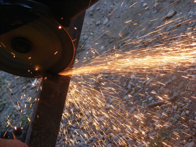 Angle grinding a welded fabrication