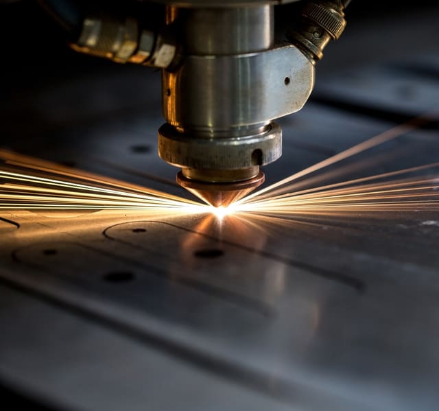 Laser head profiling holes in sheet steel